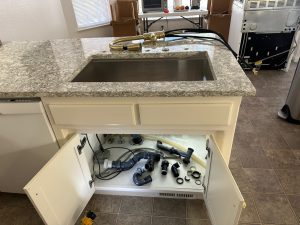 main picture replacing kitchen sink pipes