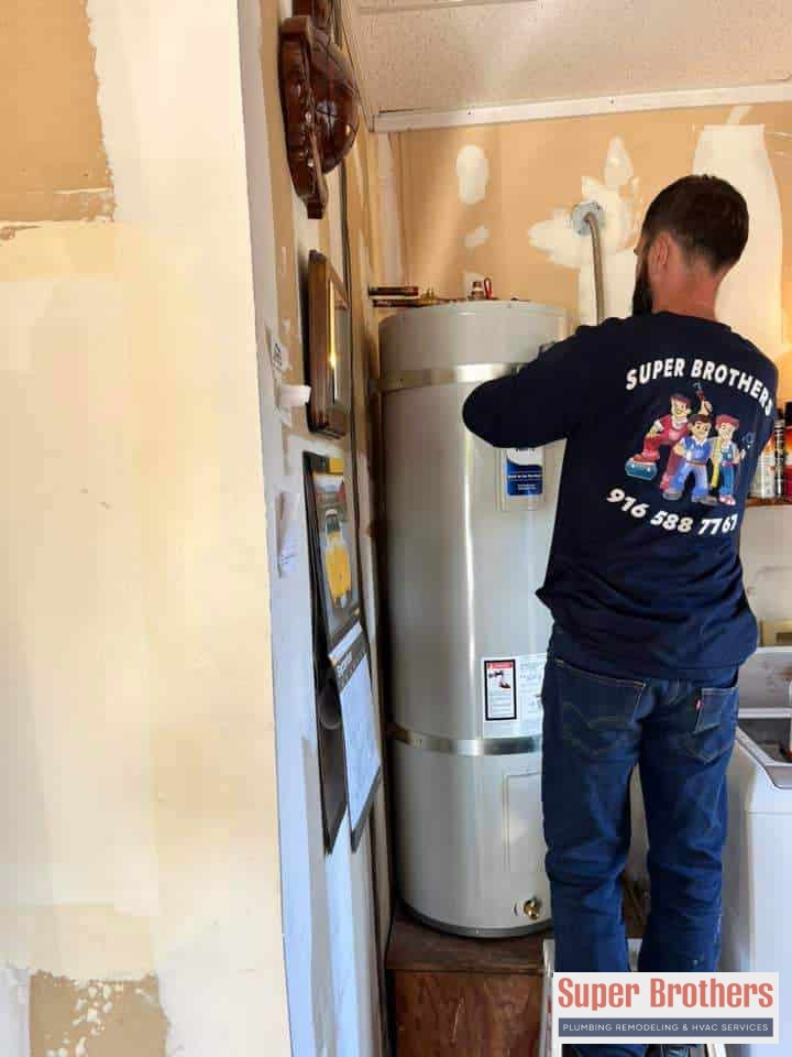 plumbing technician replacing the water heater