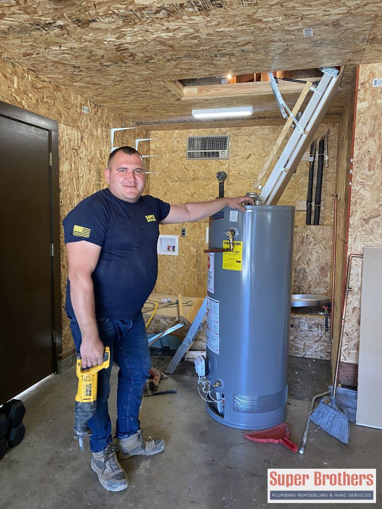 plumbing professional installing the water heater