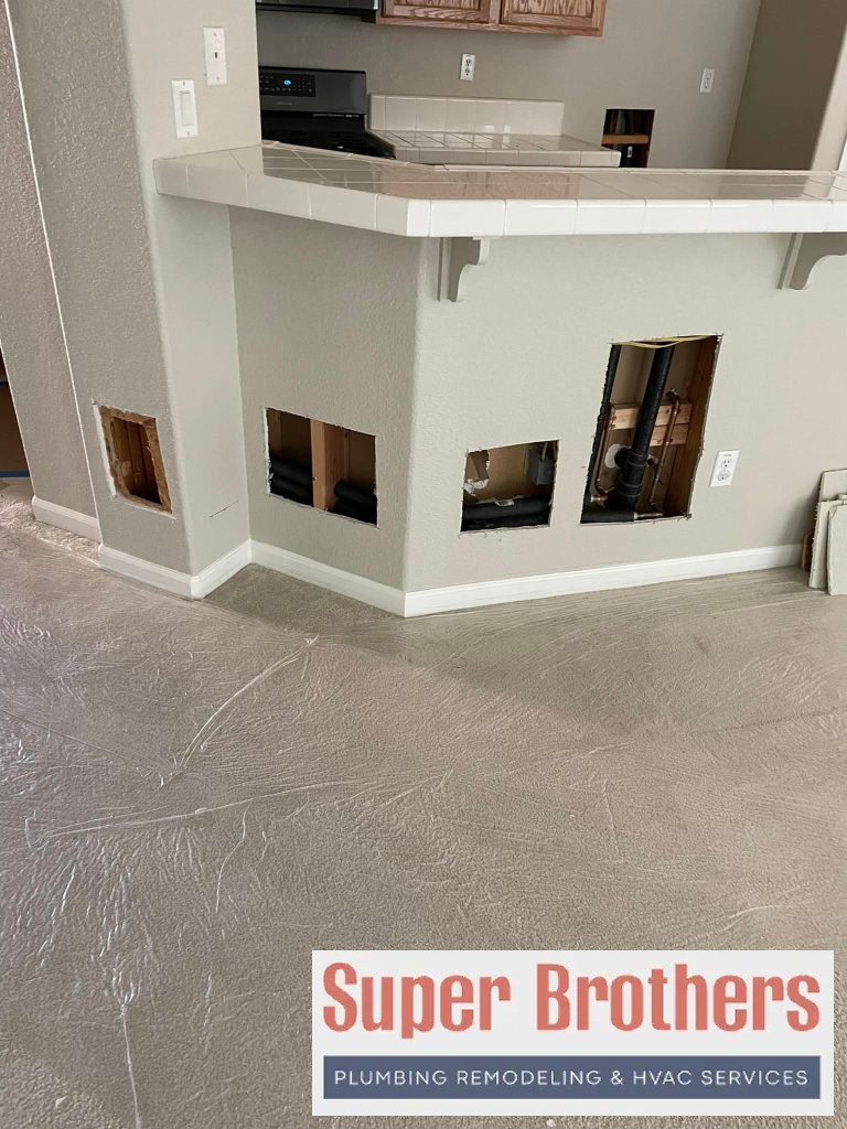 cutting in the sheetrock to fix the water leak