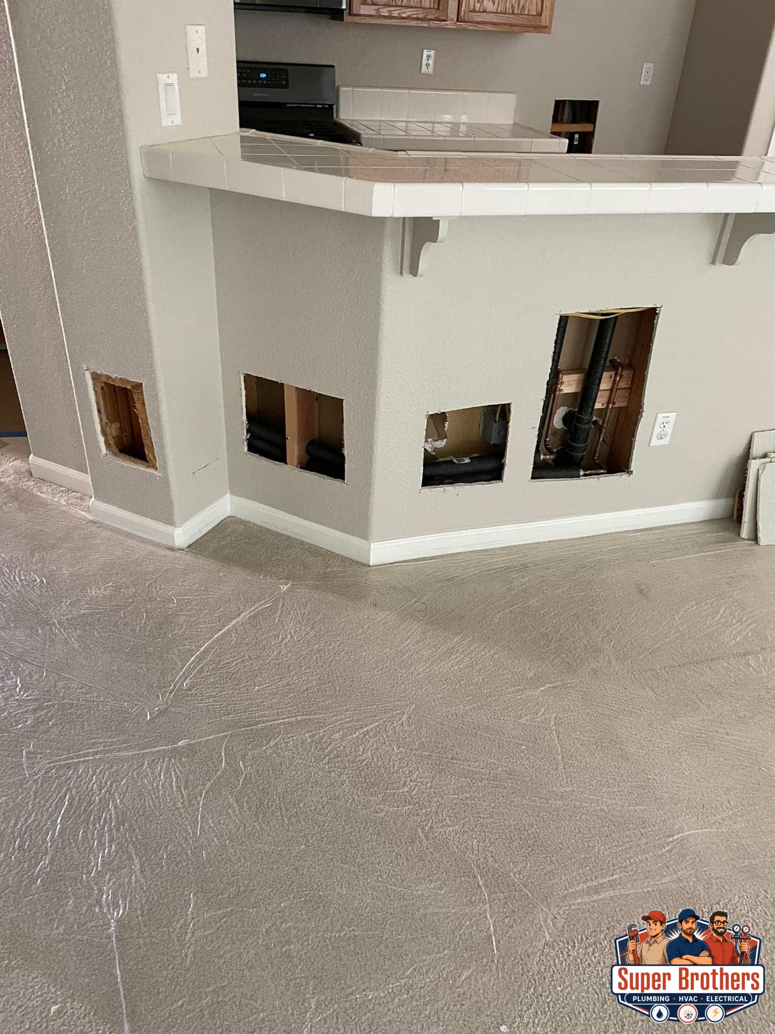 process of cutting into walls to repair active water leaks