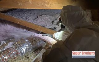 technician put insulation in the attic