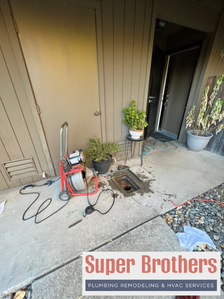 drain cleaning with drain machine through clean out