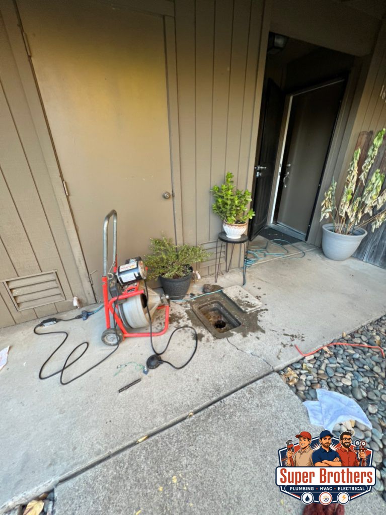 drain cleaning with drain machine through clean out