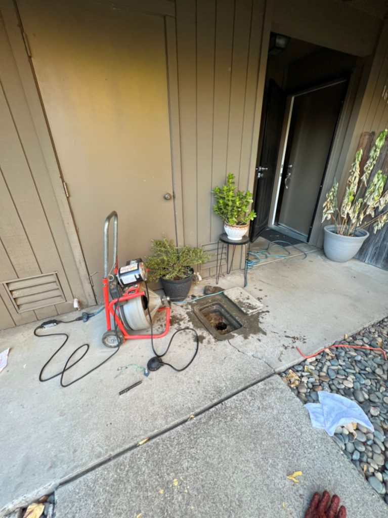 drain cleaning with drain machine through clean out