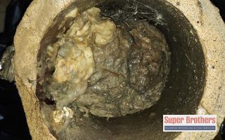 clog in old sewer pipe