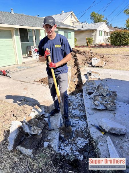 digging the trench for sewer line installation