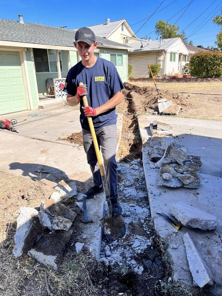 digging the trench for sewer line installation