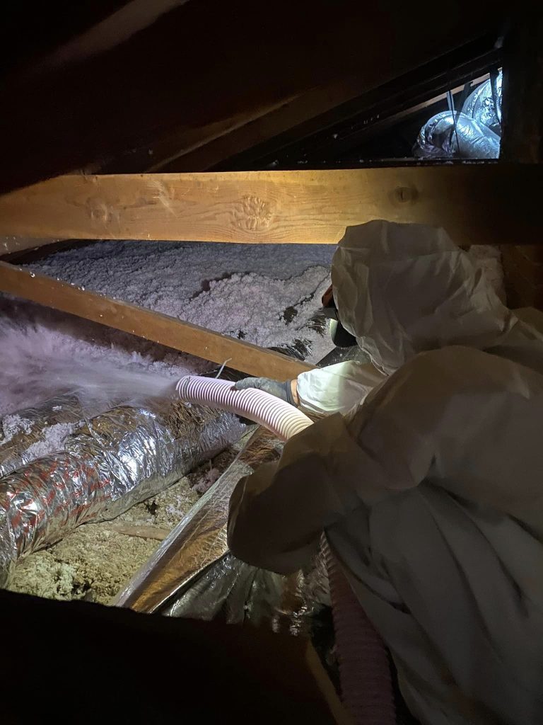 vacuum old non efficient cellulose insulation
