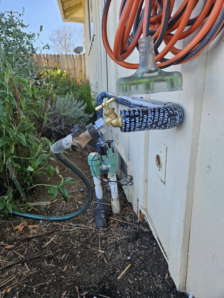 installing a backflow preventer on the spigot