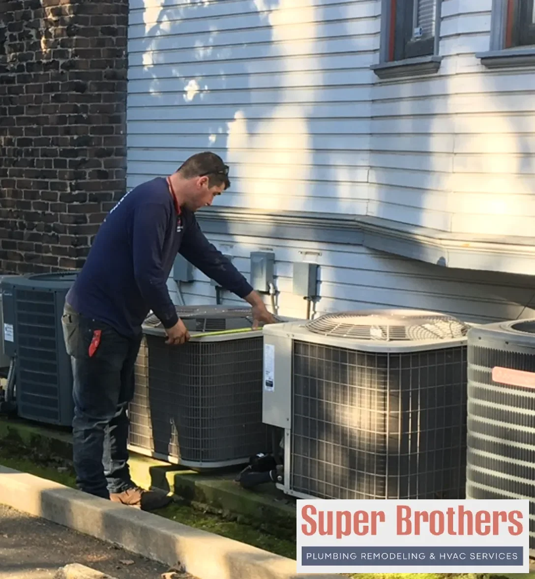 HVAC technician servicing a Sacramento air conditioner during summer heat