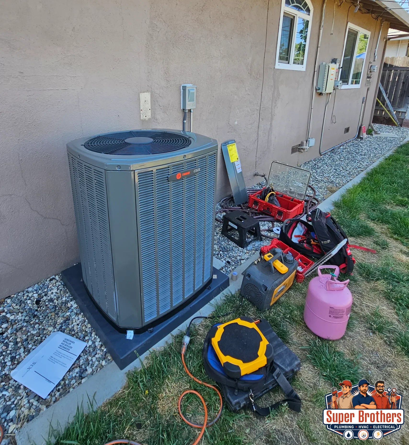 HVAC technician checking an AC condensate line in a Sacramento home