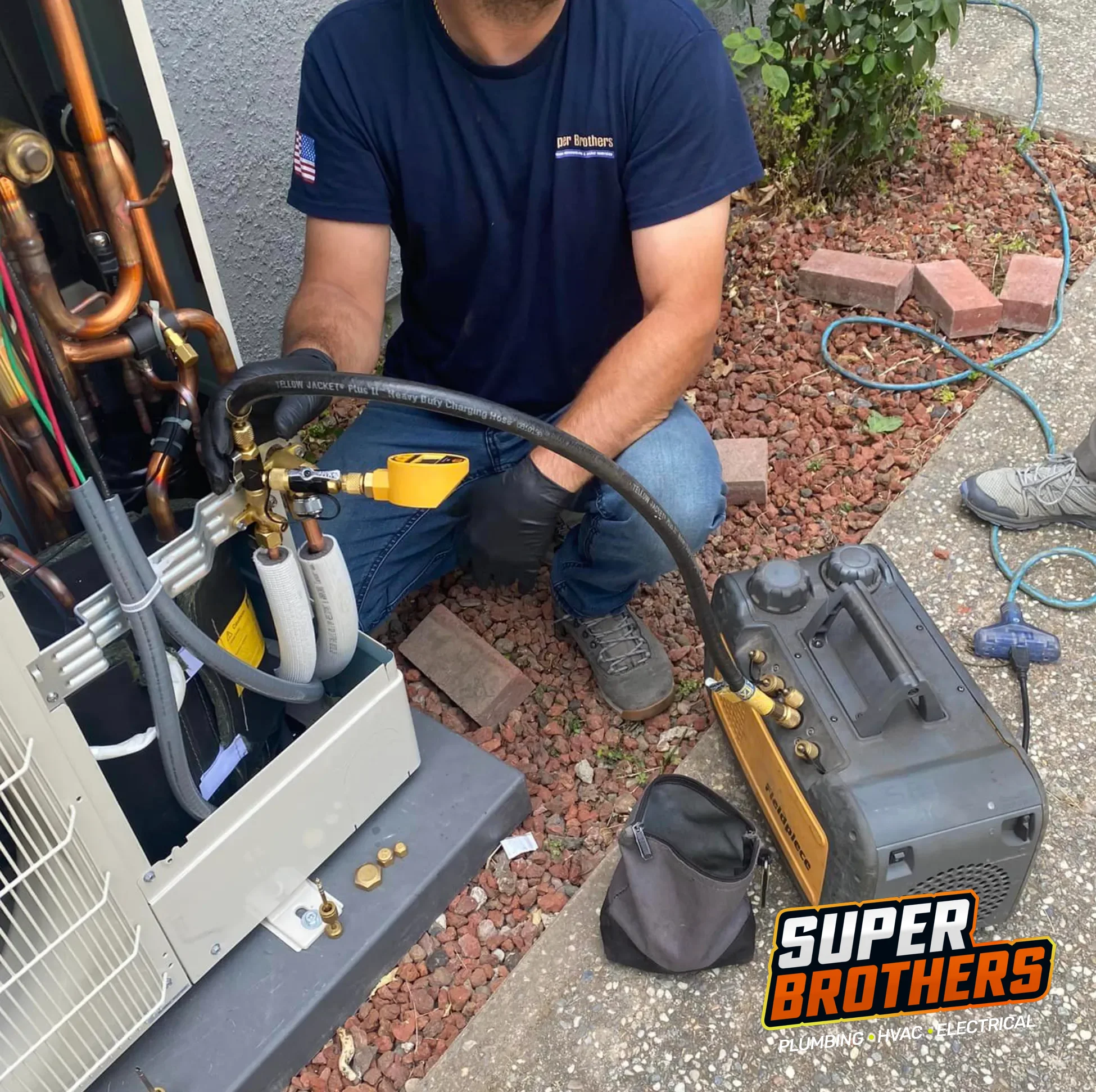 Super Brothers Technician checking an outdoor HVAC condenser during a maintenance visit