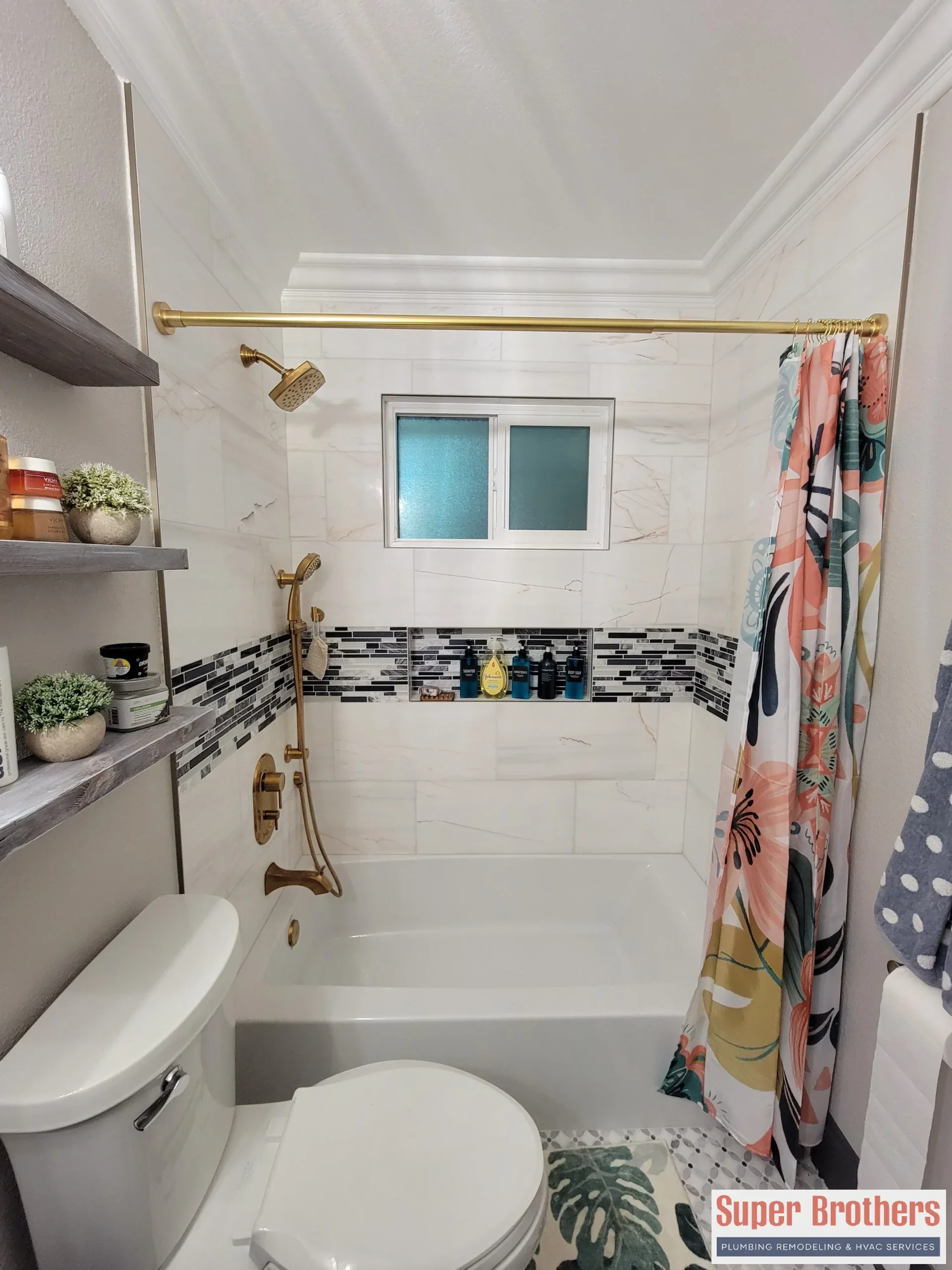 Bright modern bathroom with simple white vanity and black hardware