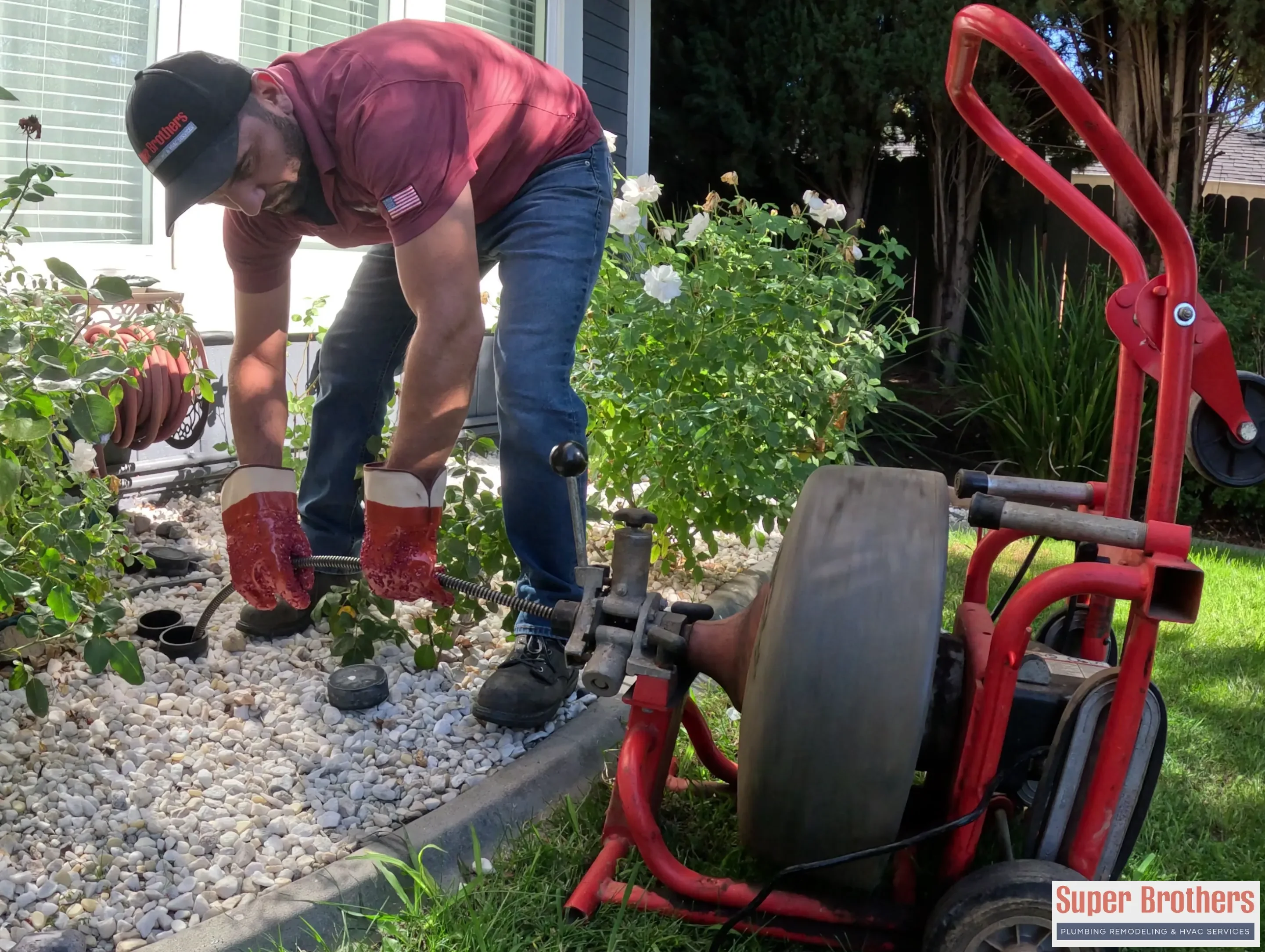 Technician accessing a residential sewer cleanout for hydro jetting and main line repair in Sacramento