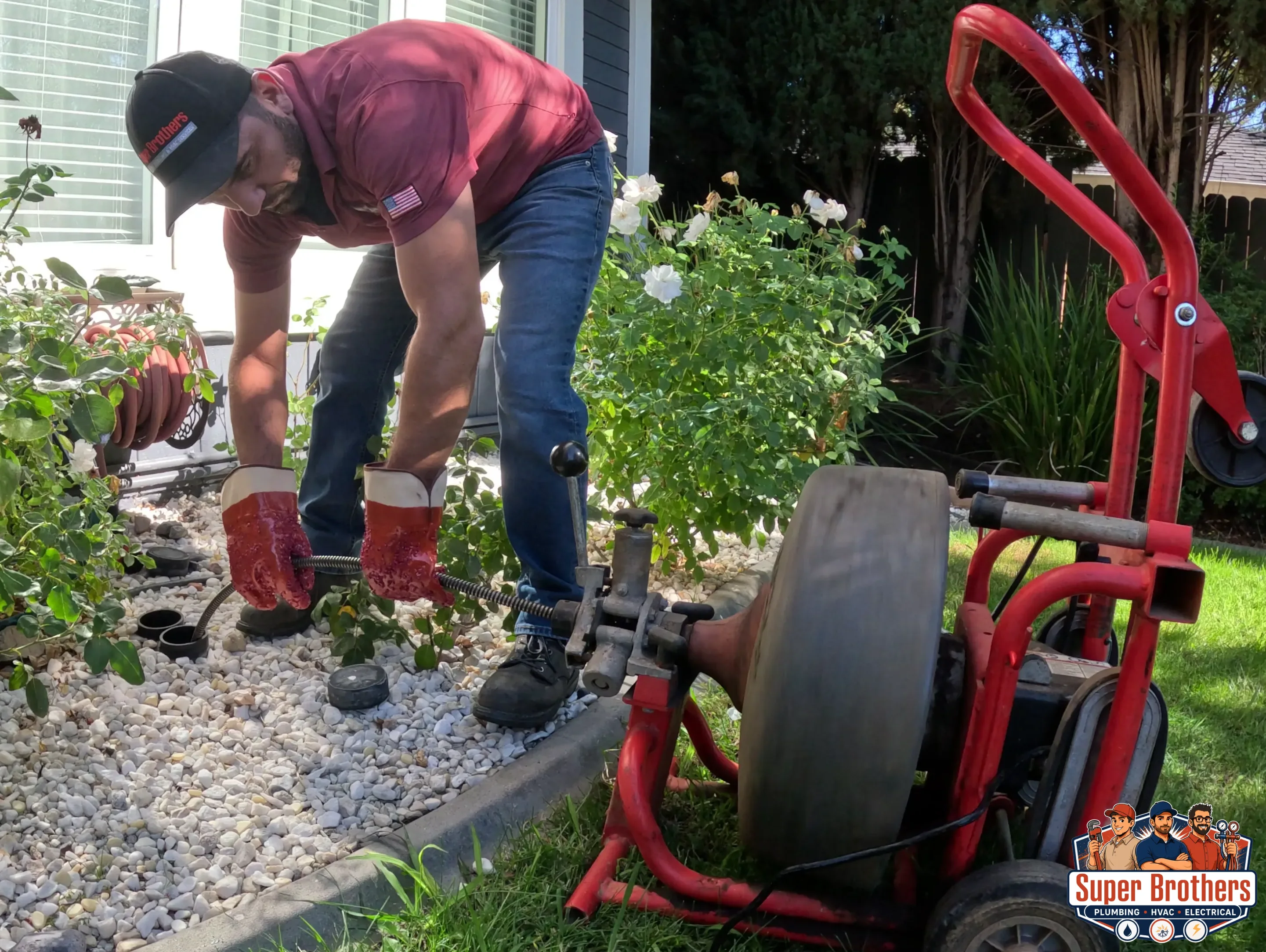 Technician accessing a residential sewer cleanout for hydro jetting and main line repair in Sacramento