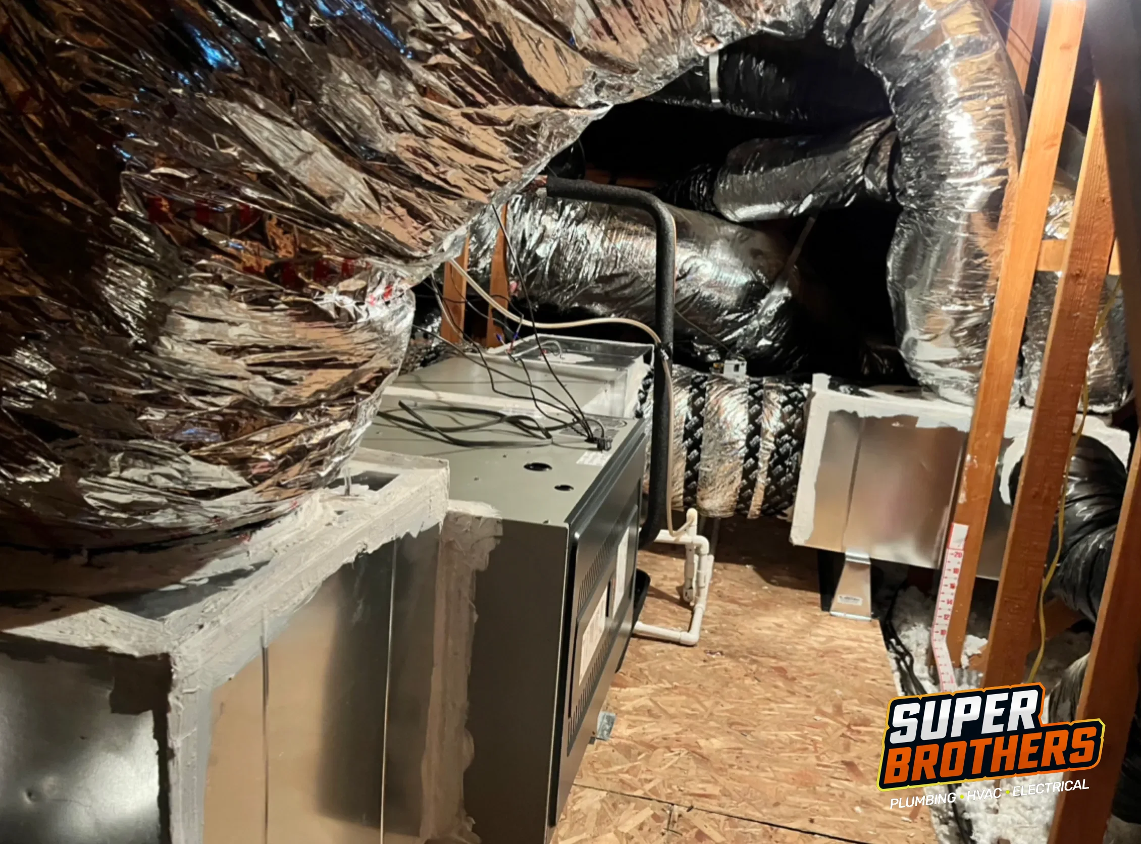 Attic ductwork being checked before AC replacement in Sacramento