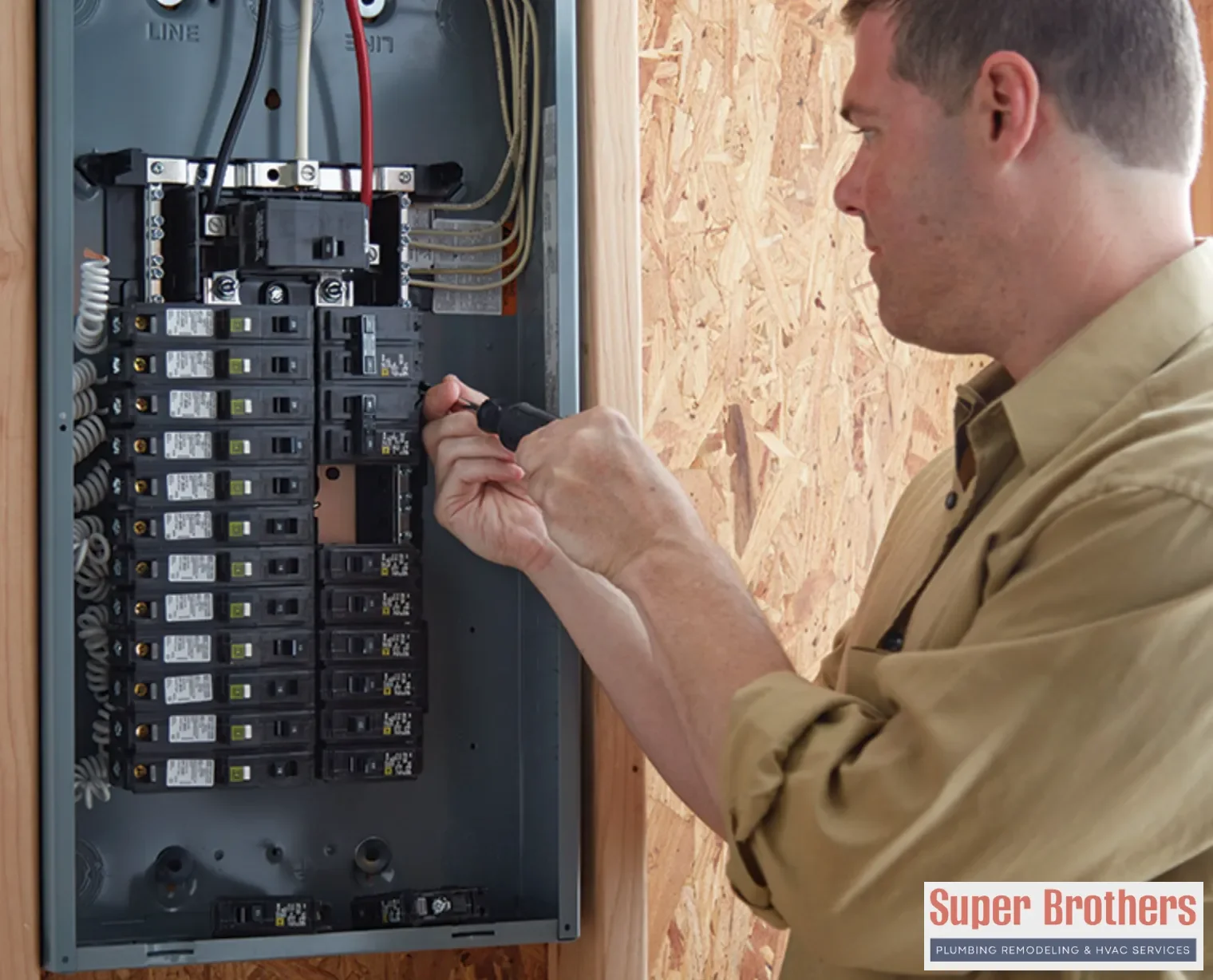 Licensed electrician inspecting an electrical panel in a Sacramento home