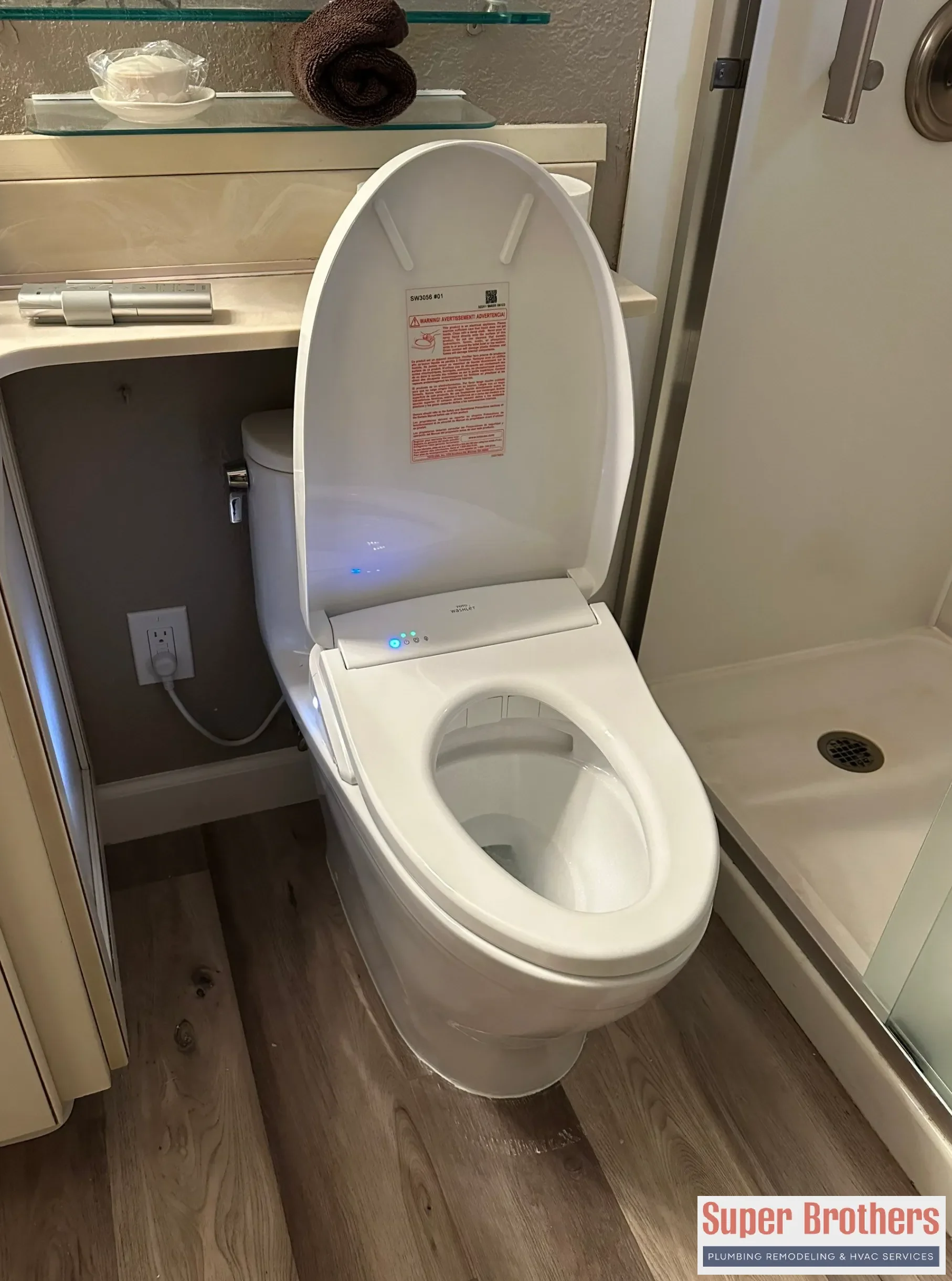 Open toilet tank showing flapper and fill valve parts