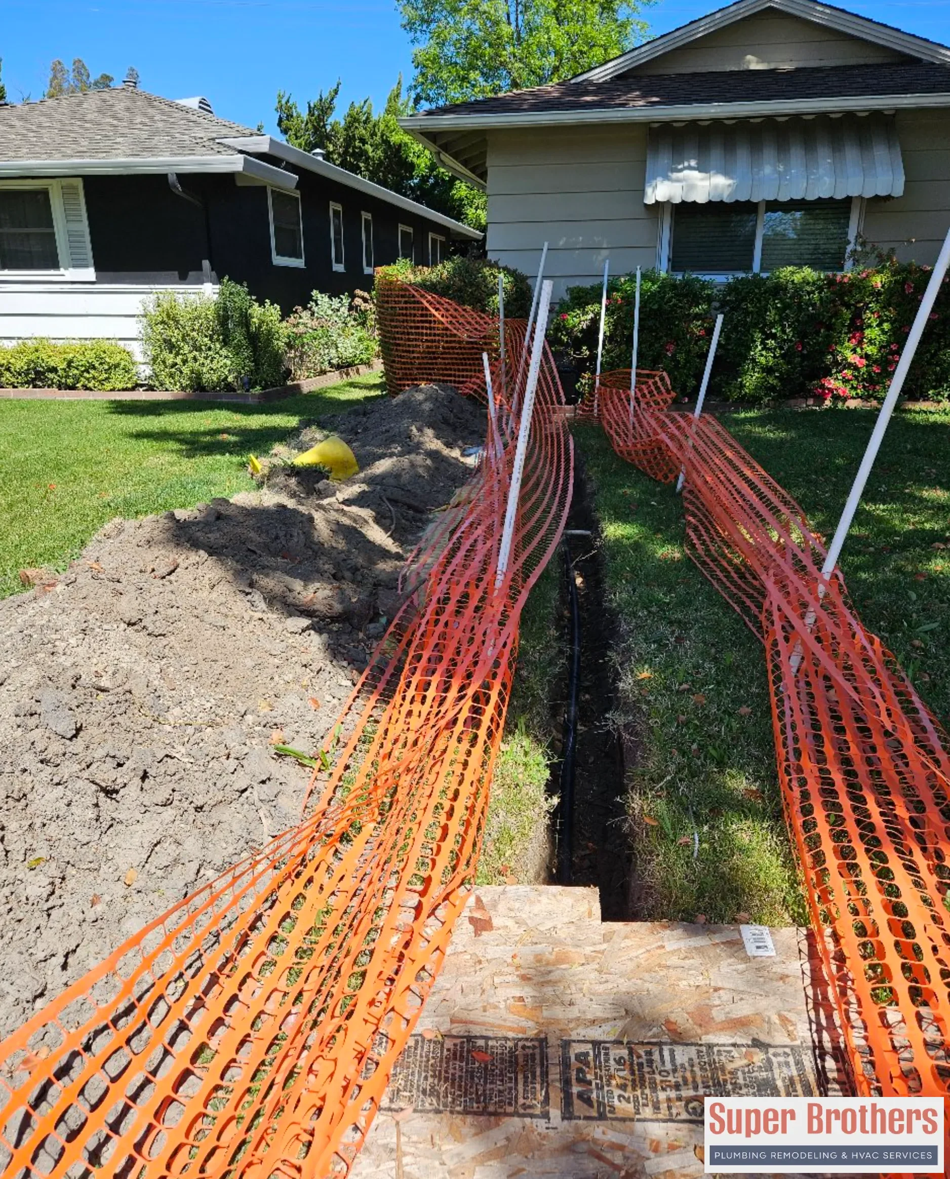 Water line trenching and repair work in a Sacramento front yard