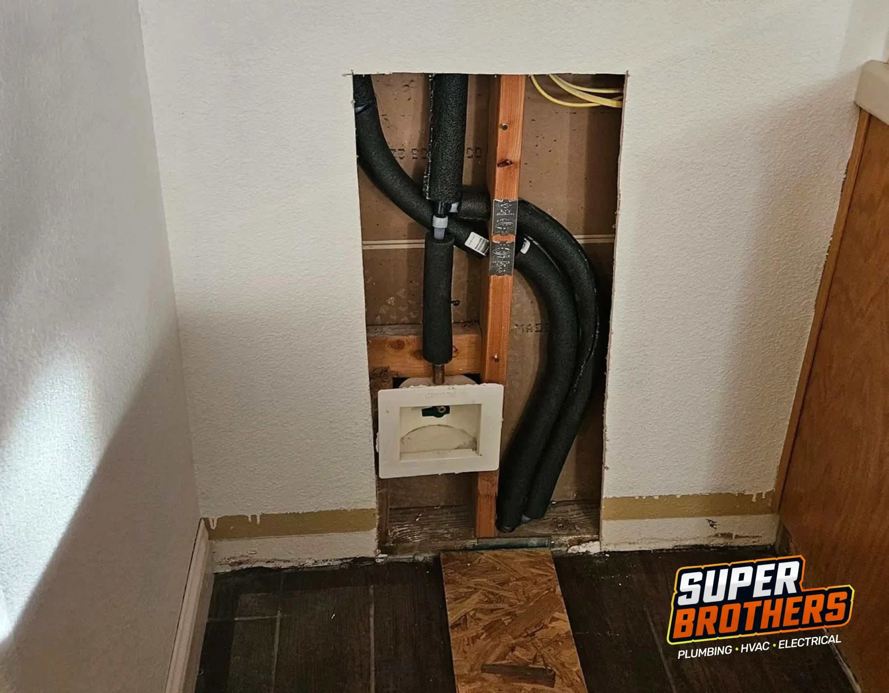 Wall access opened for a residential repipe