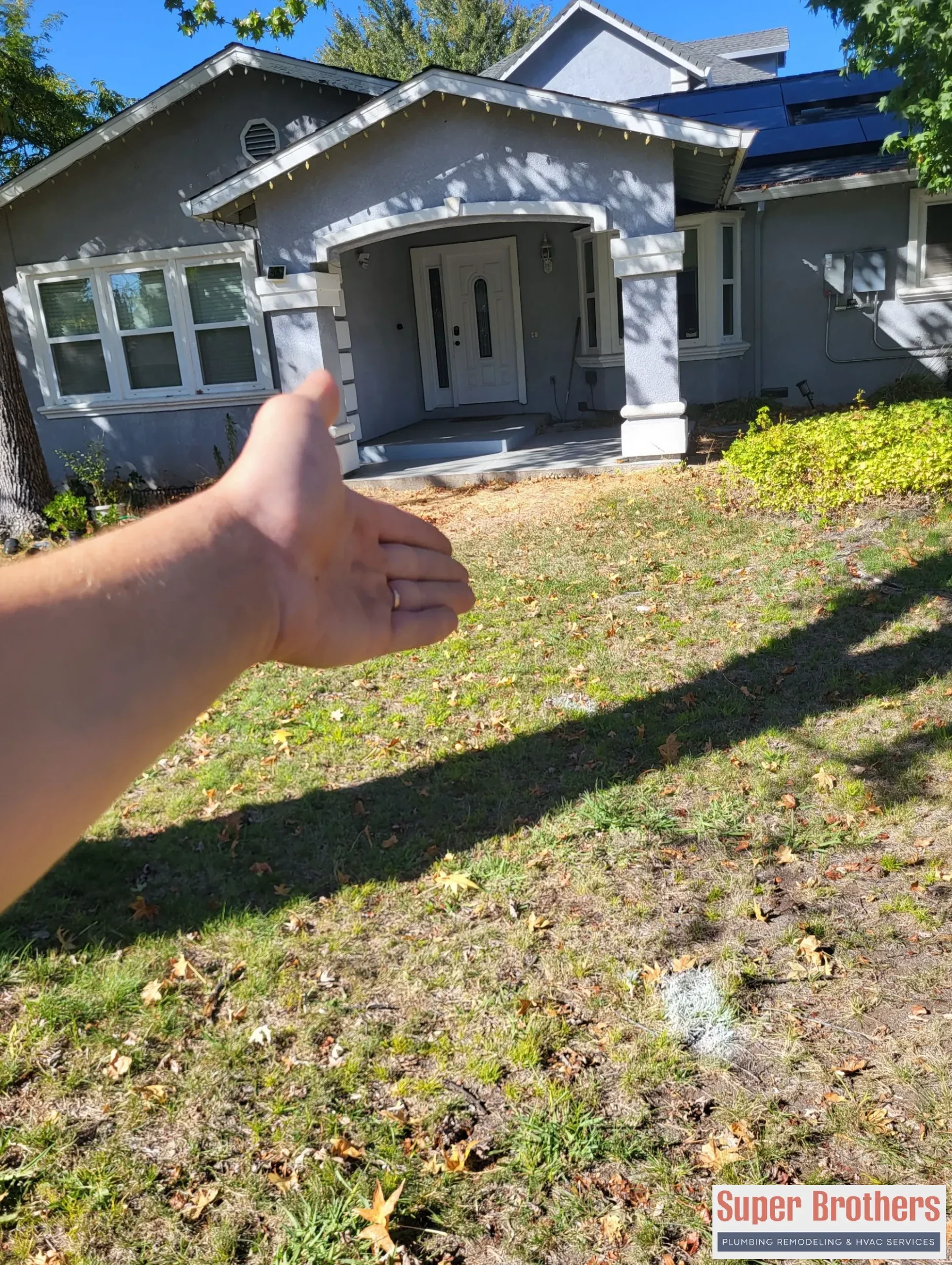 Sacramento homeowner reviewing sewer repair estimate with plumber