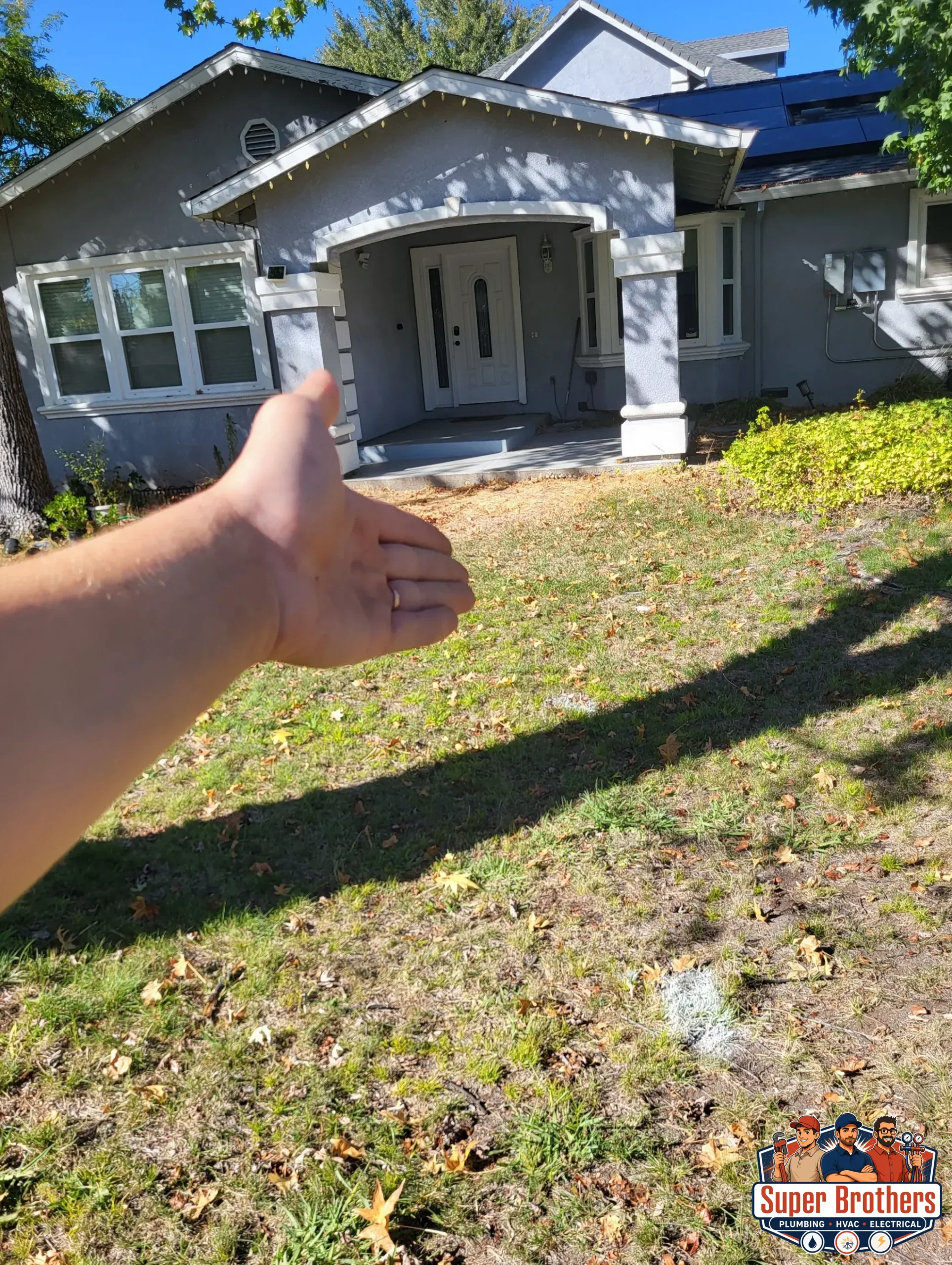 Sacramento homeowner reviewing sewer repair estimate with plumber