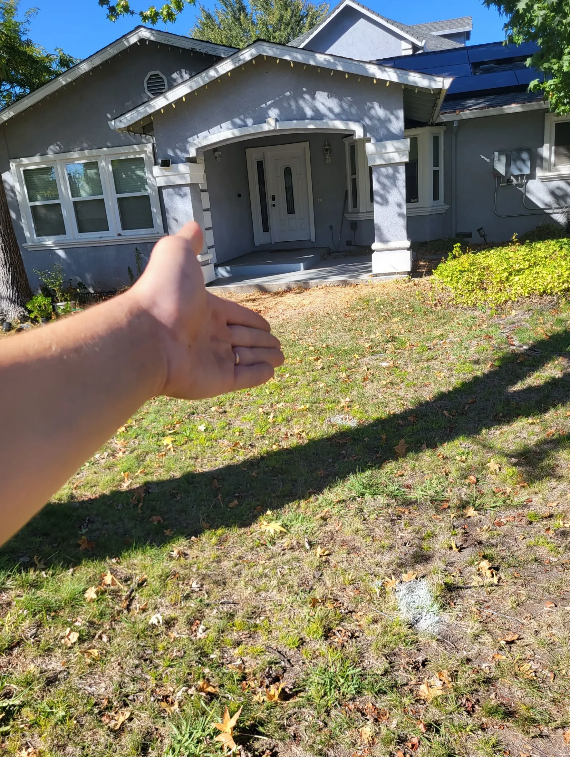 Sacramento homeowner reviewing sewer repair estimate with plumber