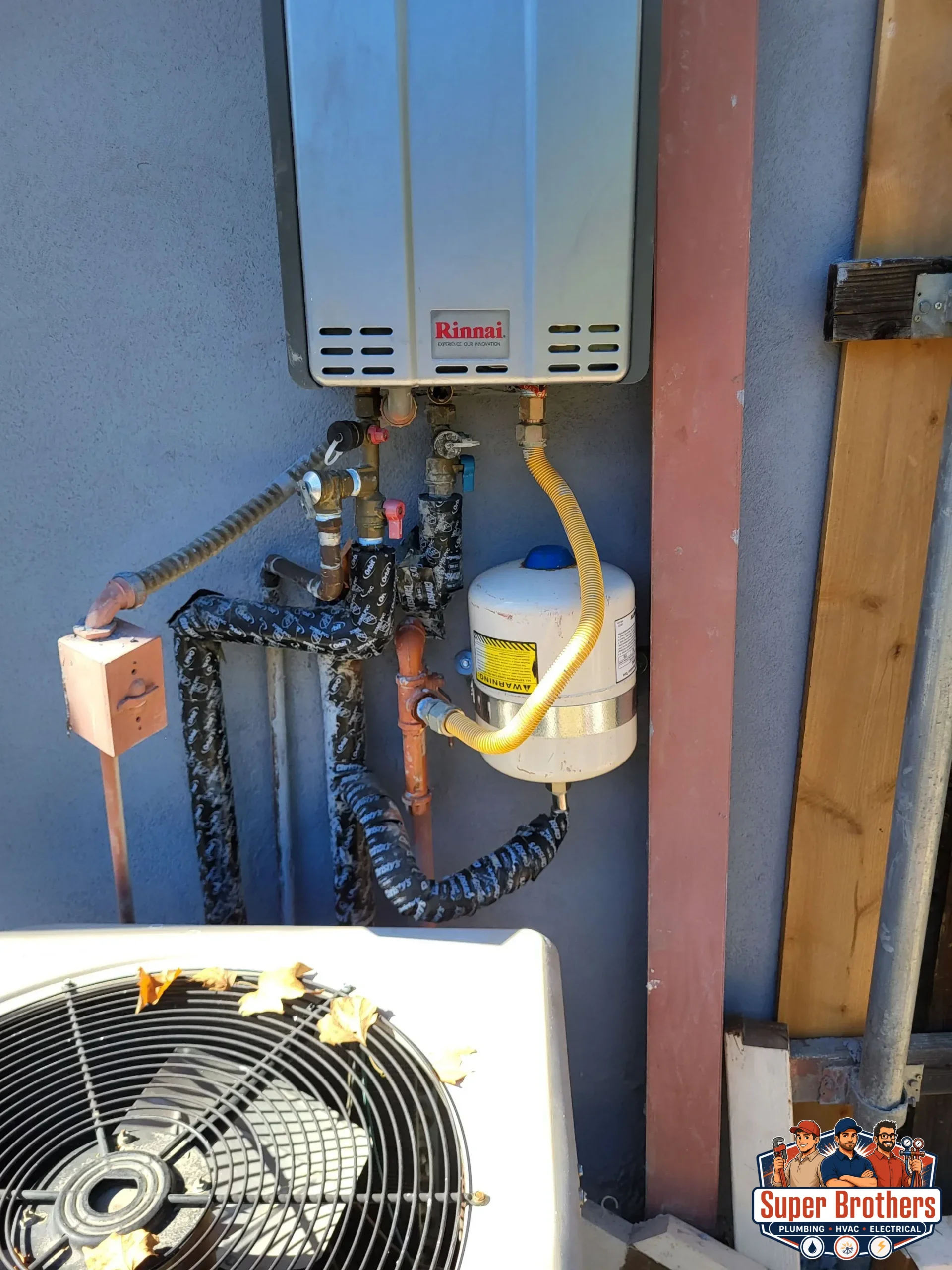 Wall mounted tankless water heater with recirculation pump in a utility room