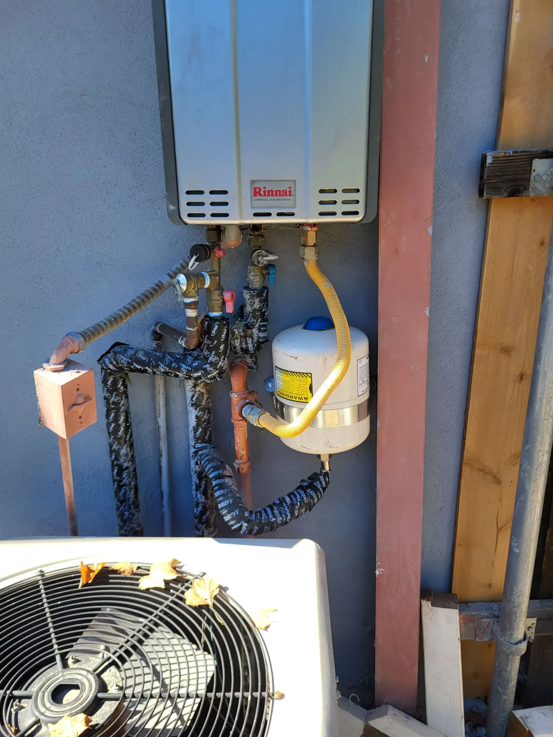 Side-by-side comparison of Rinnai, Navien, and Noritz tankless water heaters