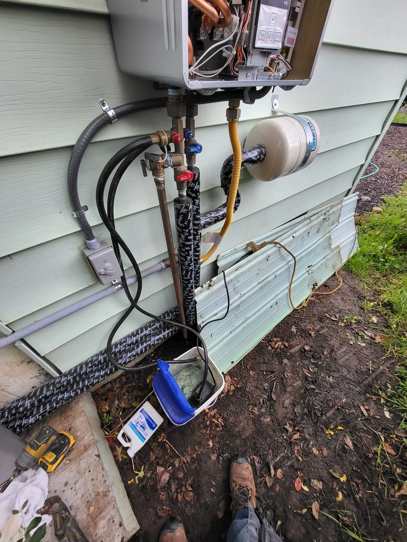 Technician performing annual descaling and filter cleaning
