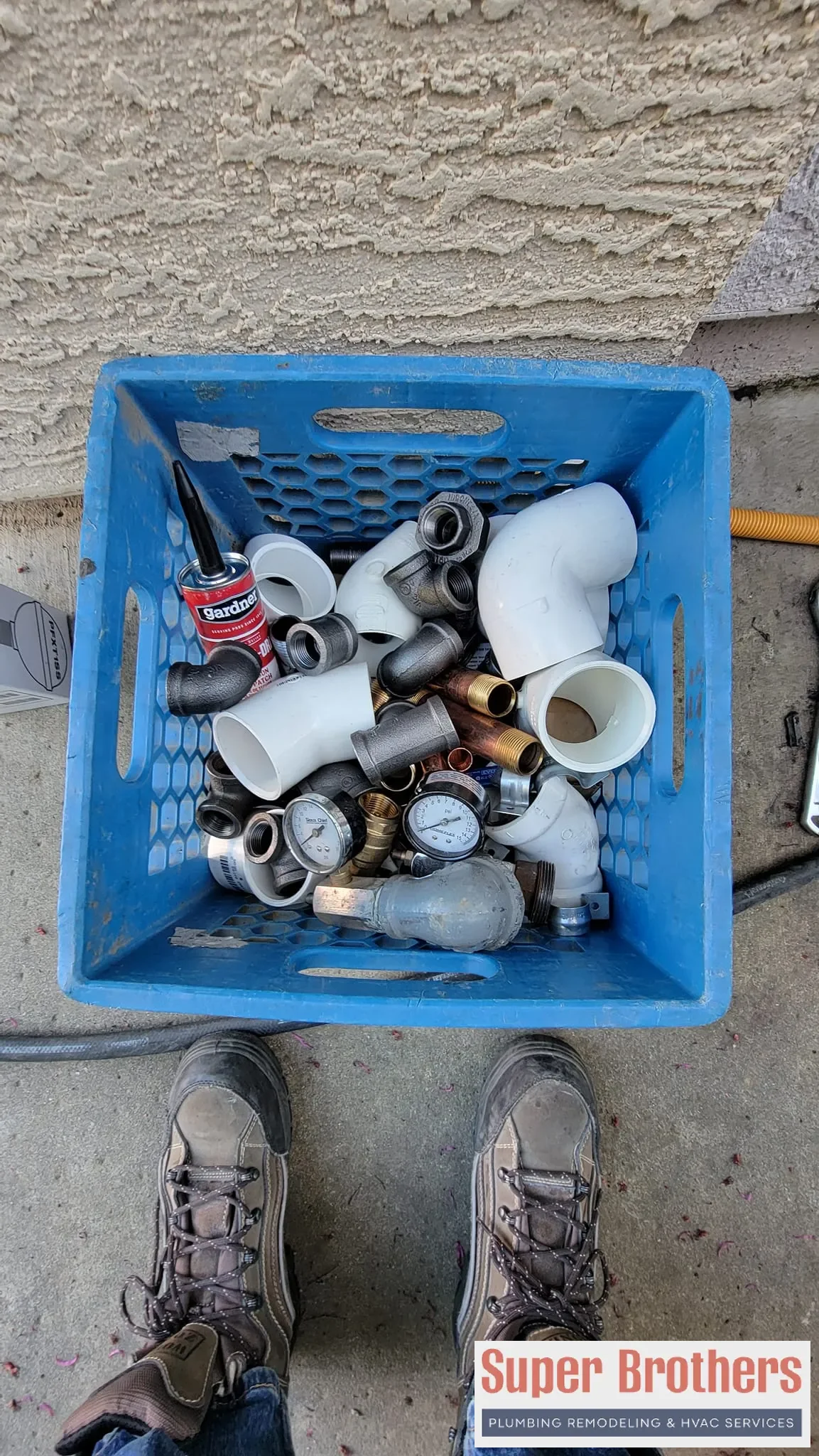 Super Brothers plumber discussing slab leak repair options with a Sacramento homeowner