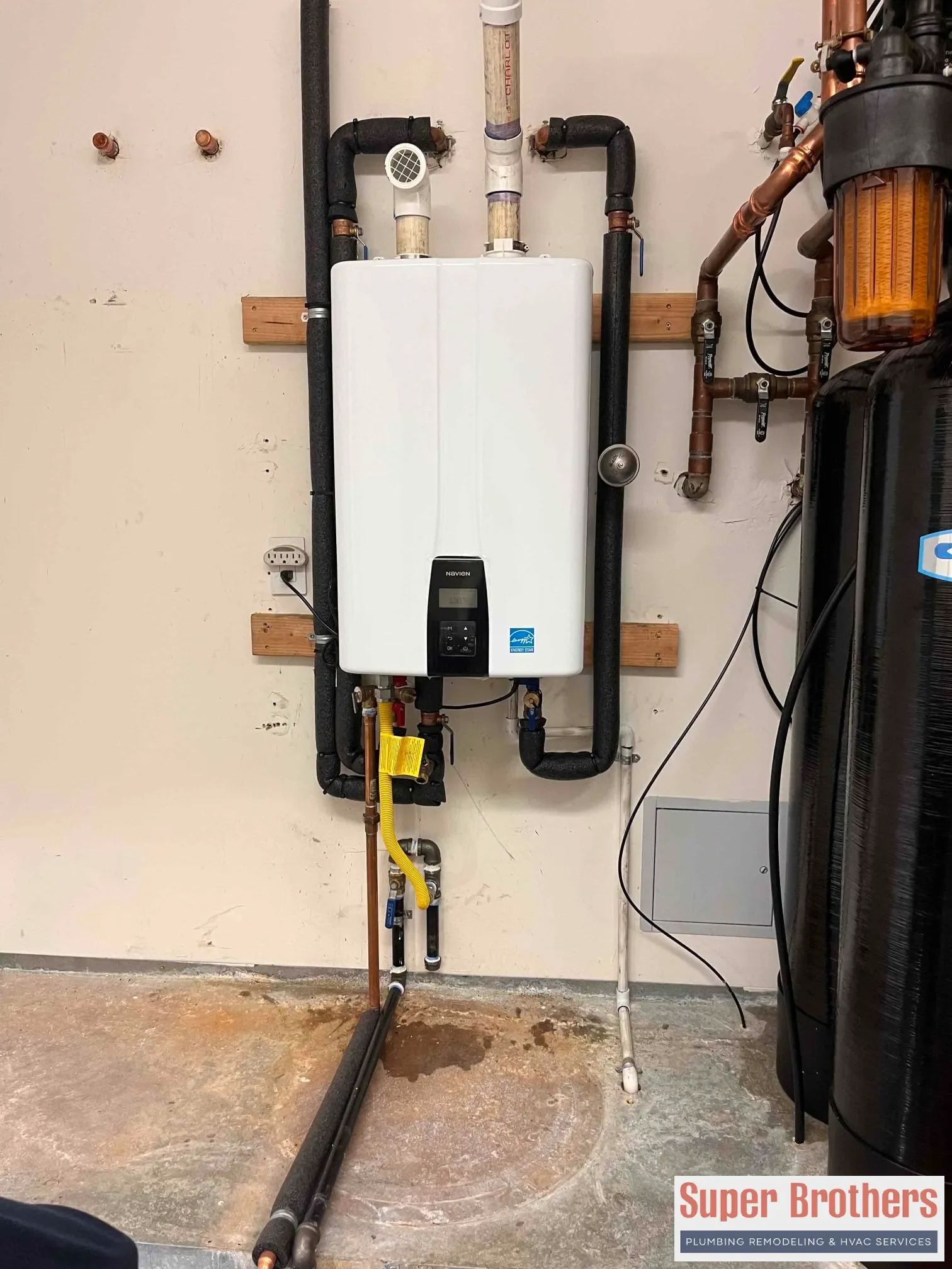 Cutaway view of tankless water heater showing flow sensor and heat exchanger