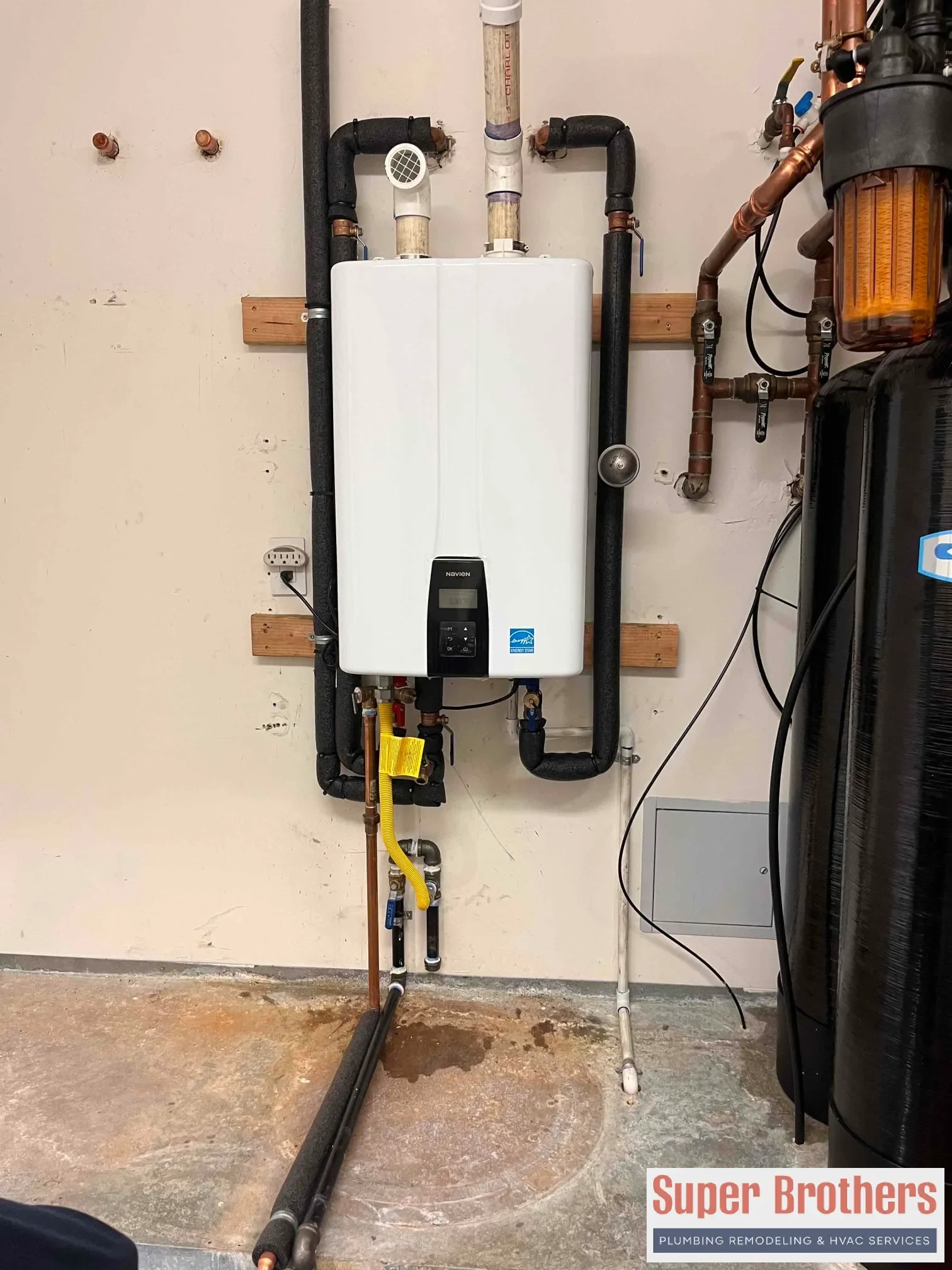 Cutaway view of tankless water heater showing flow sensor and heat exchanger