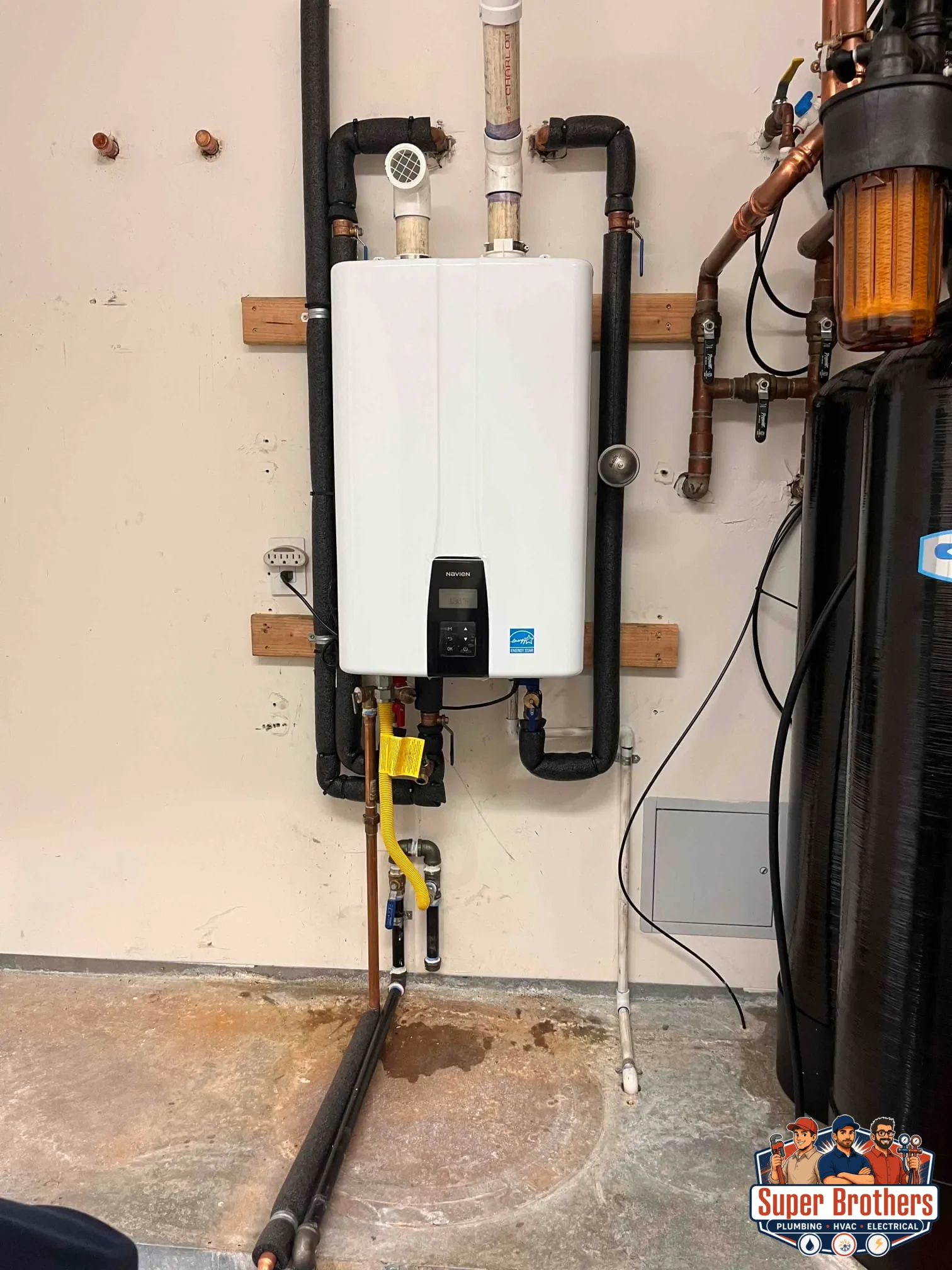 Cutaway view of tankless water heater showing flow sensor and heat exchanger