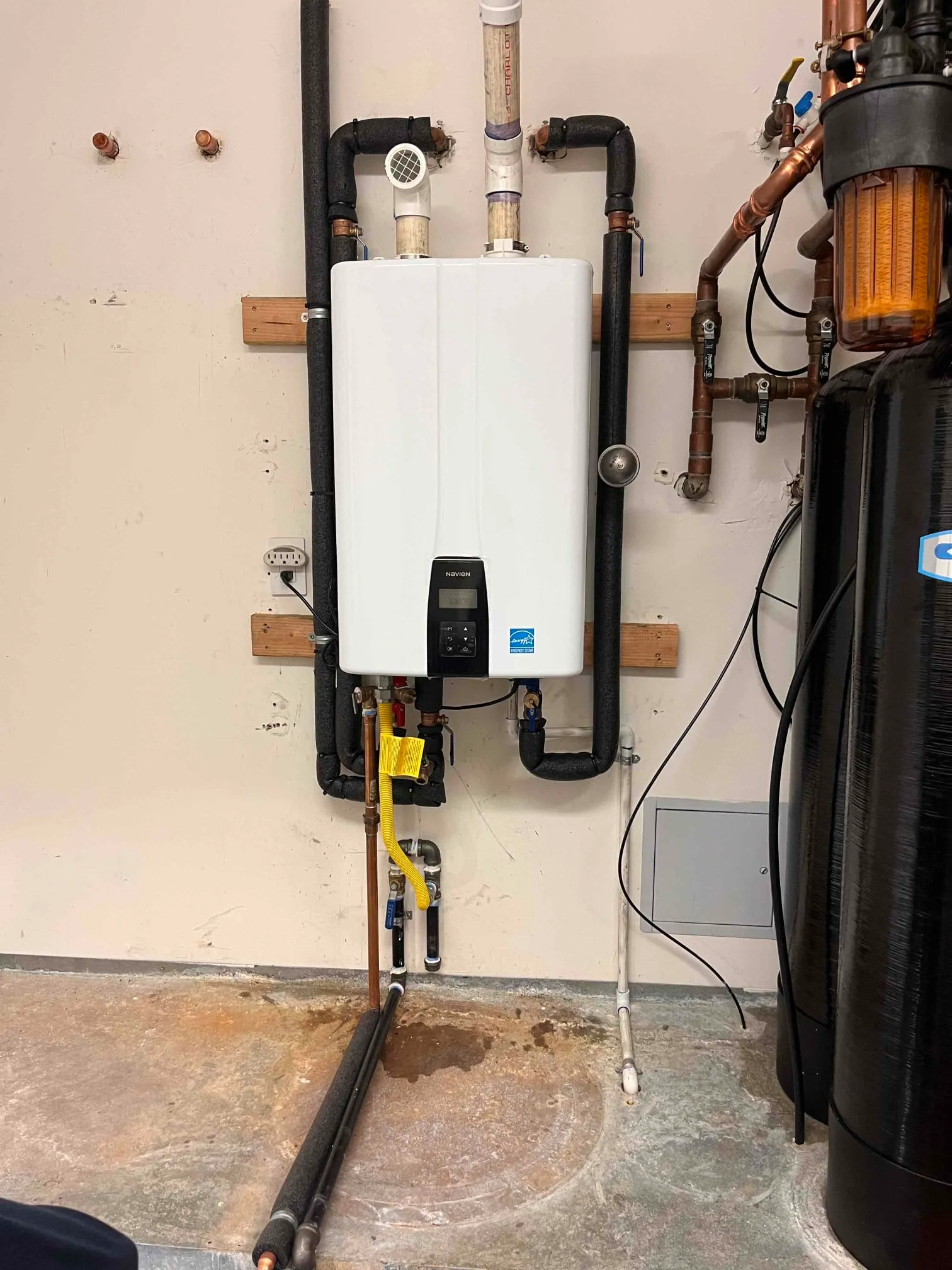 Cutaway view of tankless water heater showing flow sensor and heat exchanger