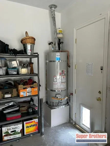 A Super Brothers plumber inspecting pipes in a home