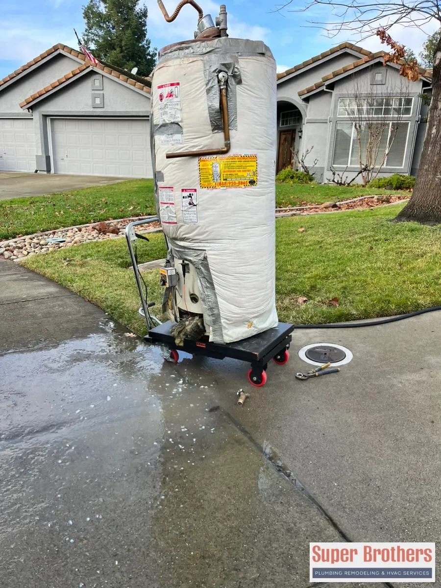 Plumber replacing a gas water heater in a Sacramento