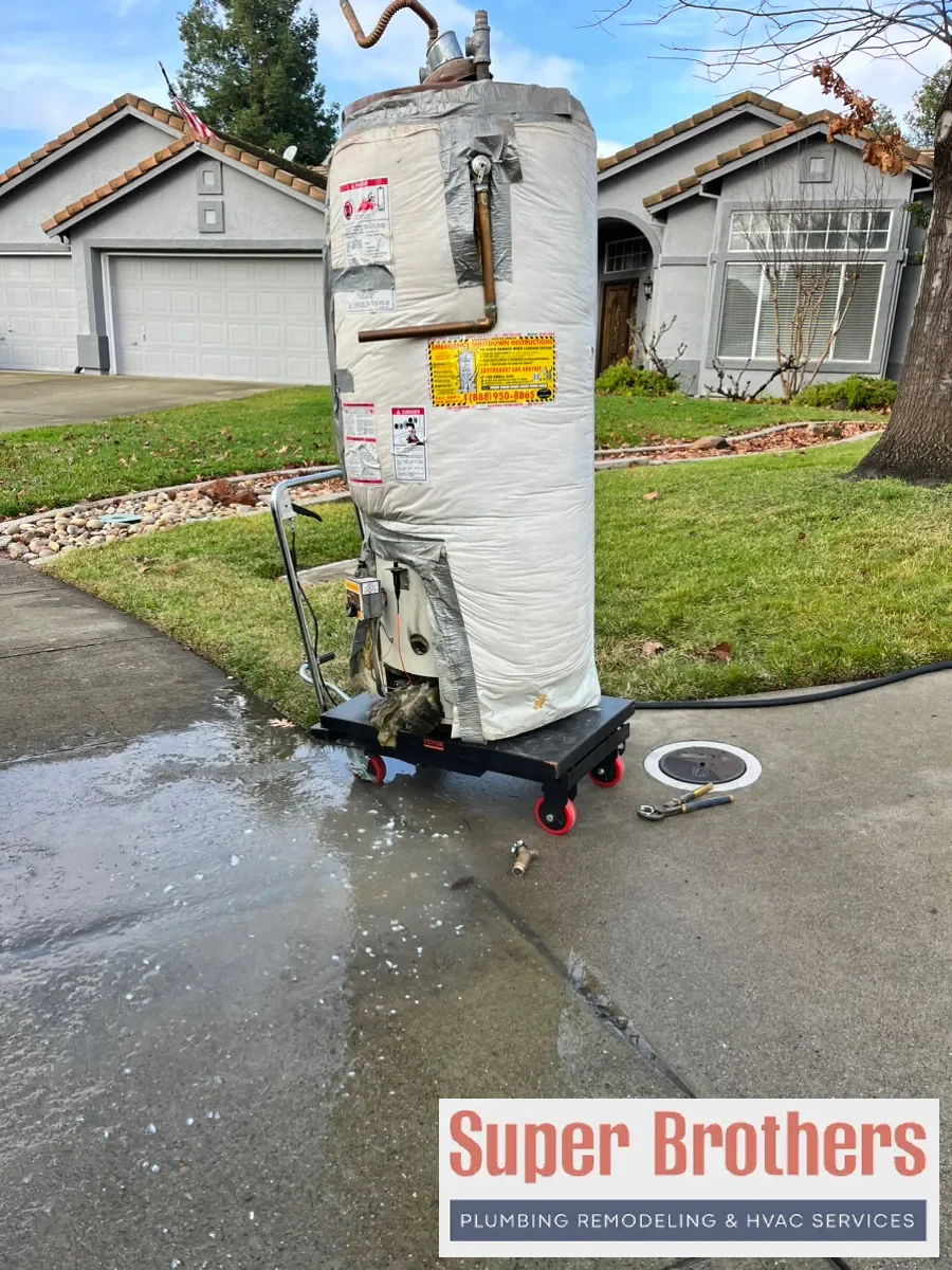 Plumber replacing a gas water heater in a Sacramento