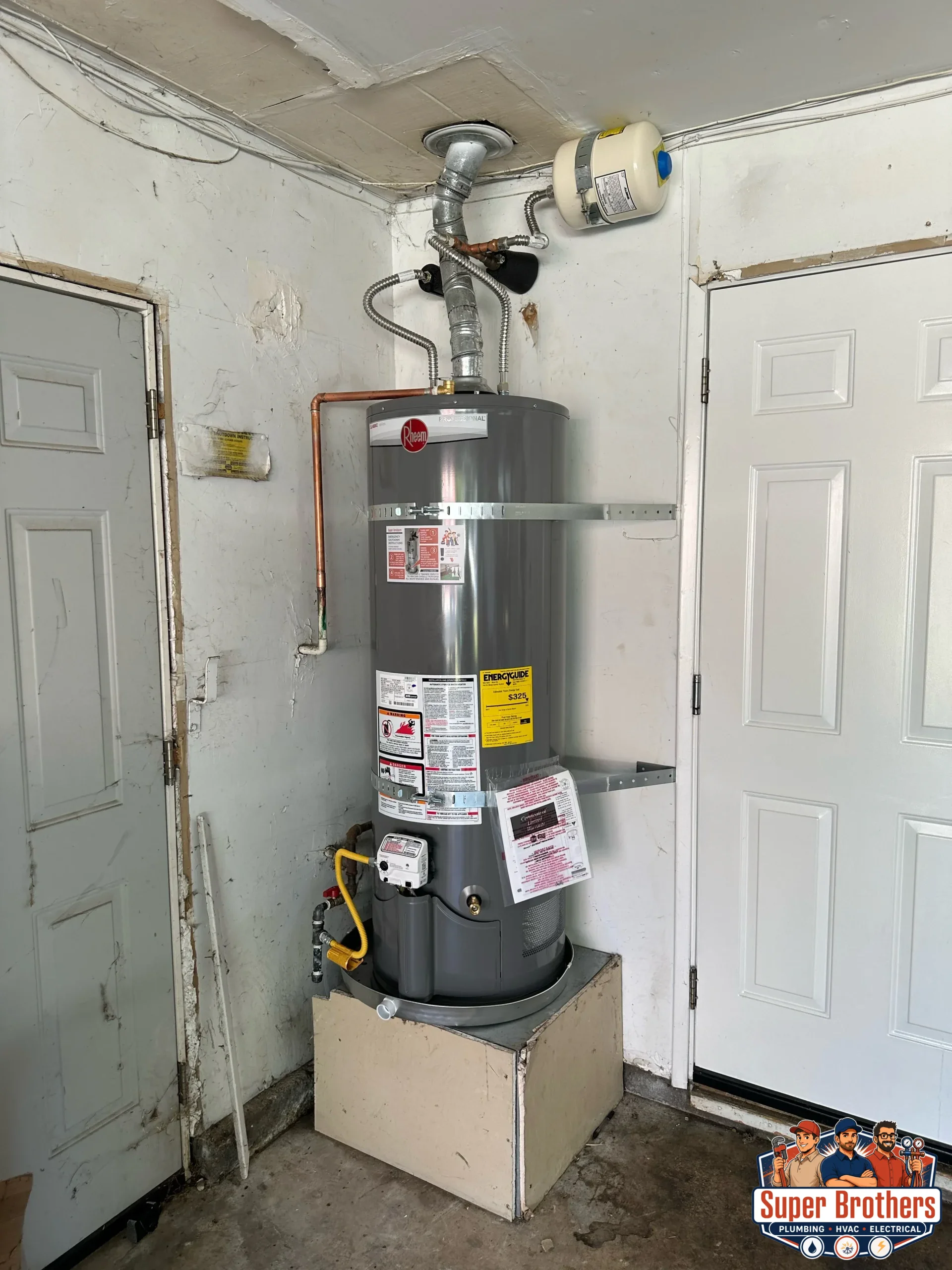 Modern water heater installed in a Sacramento garage with clean piping and bright lighting