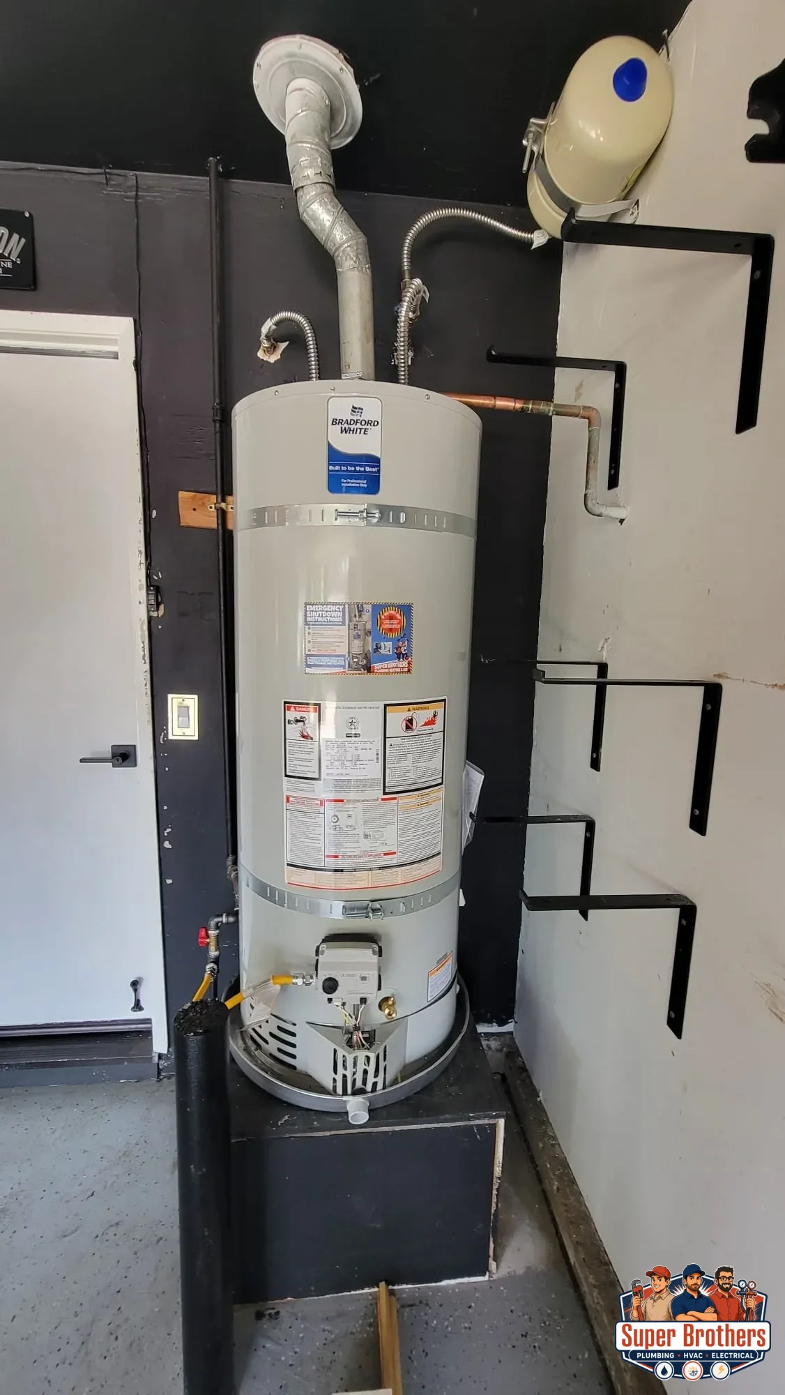 Tank water heater in a Sacramento garage with shutoff valve and expansion tank
