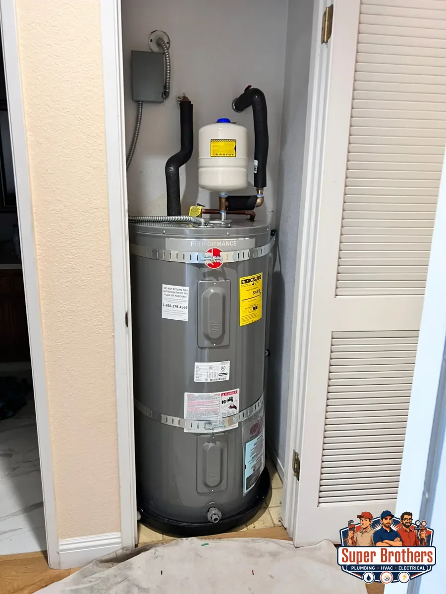 Heat pump water heater installed with proper clearance and condensate drain in Sacramento
