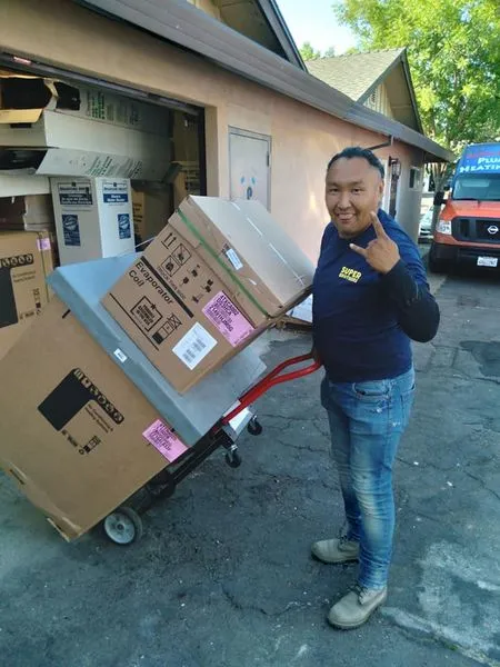 Technician marking off items on a plumbing inspection checklist