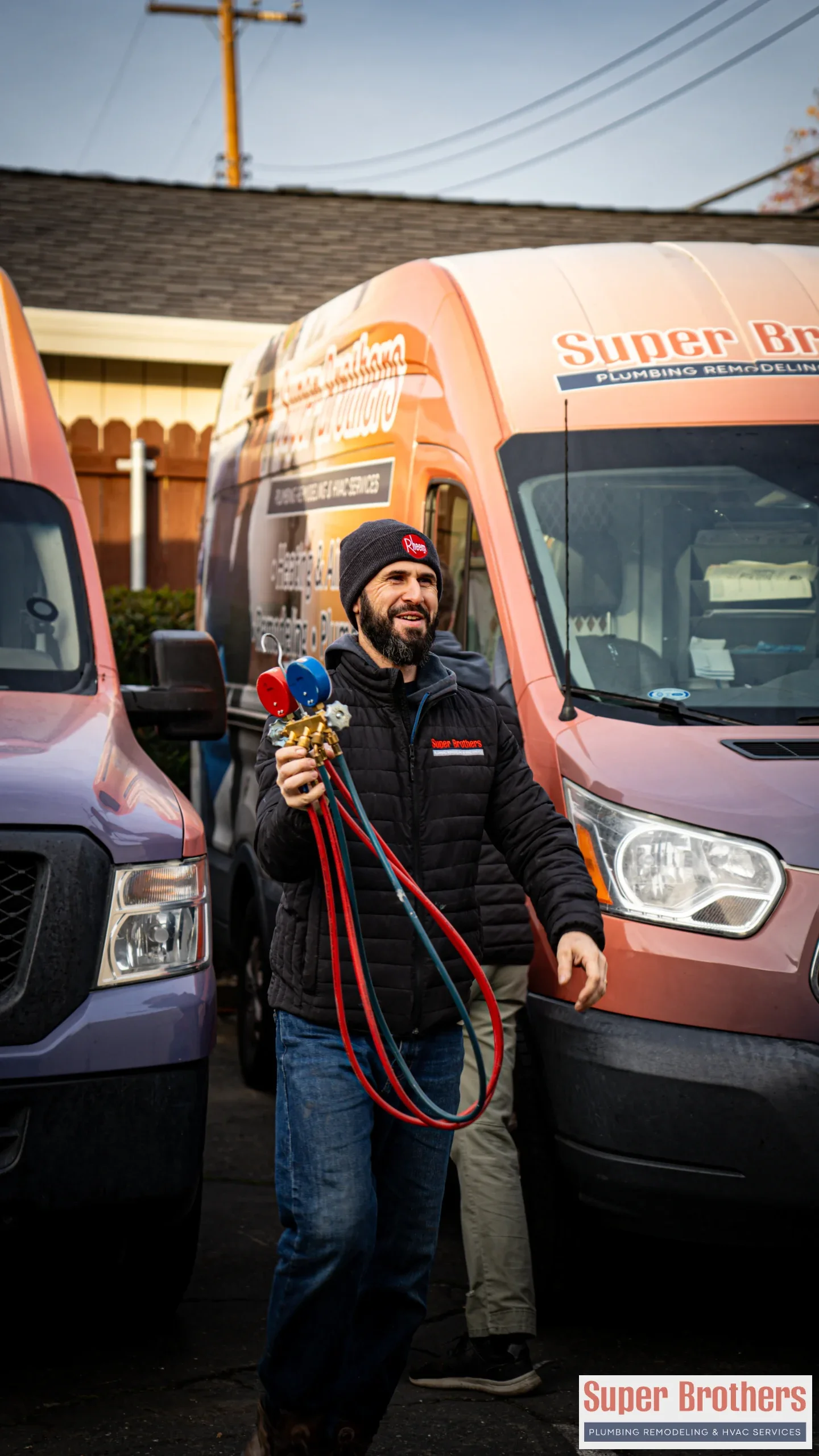 Super Brothers Technician walking with ac refill meter during a repair visit