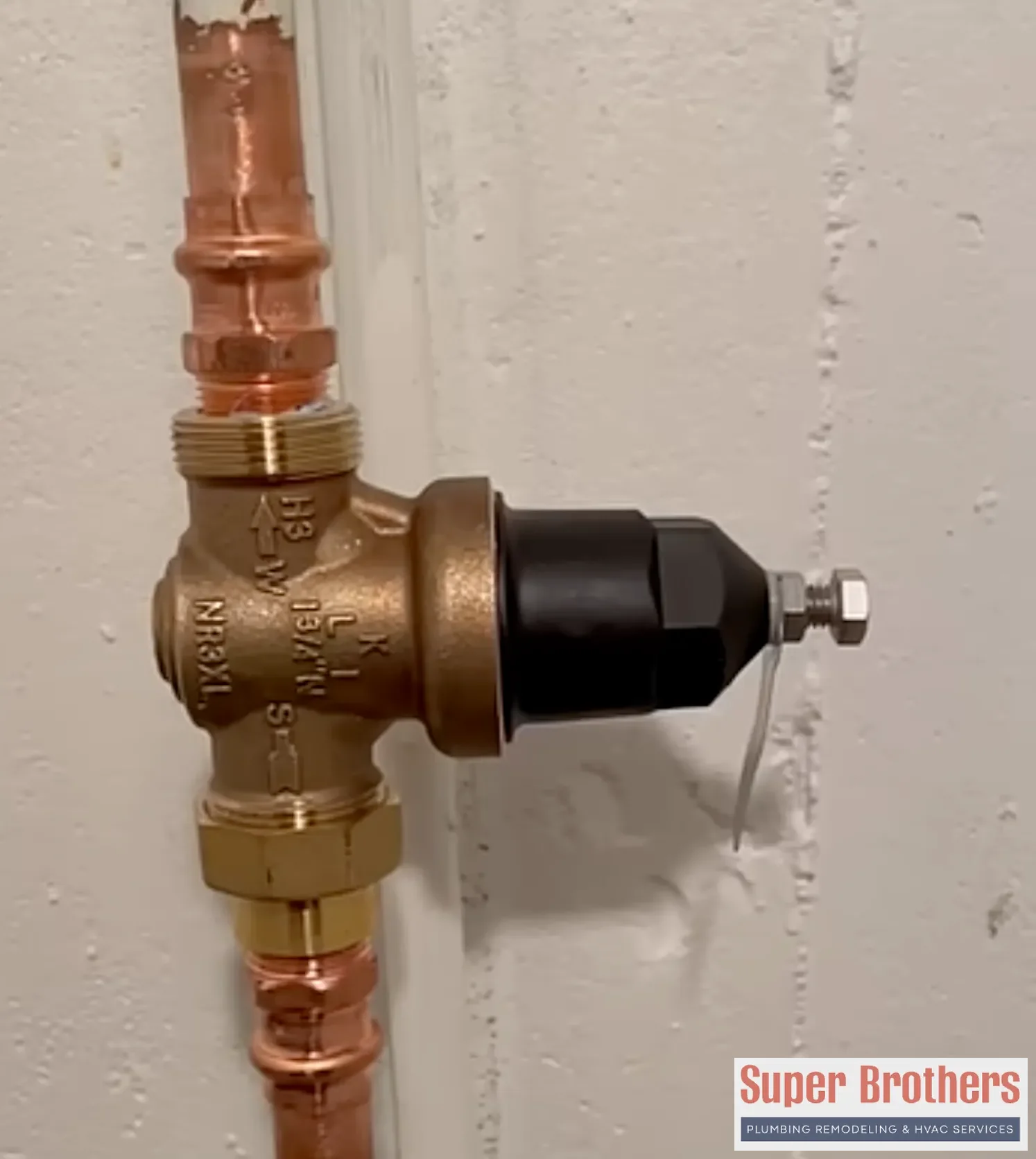 Older Bay Area home plumbing setup with main shutoff and pressure reducing valve