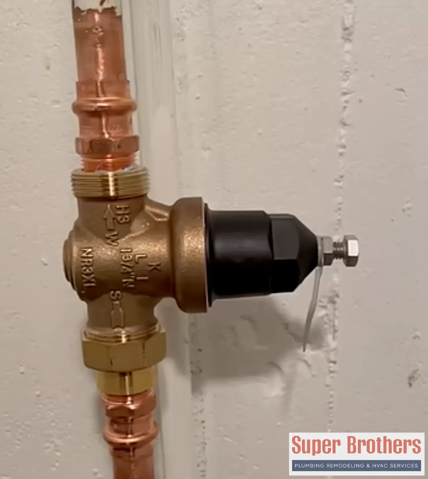Older Bay Area home plumbing setup with main shutoff and pressure reducing valve