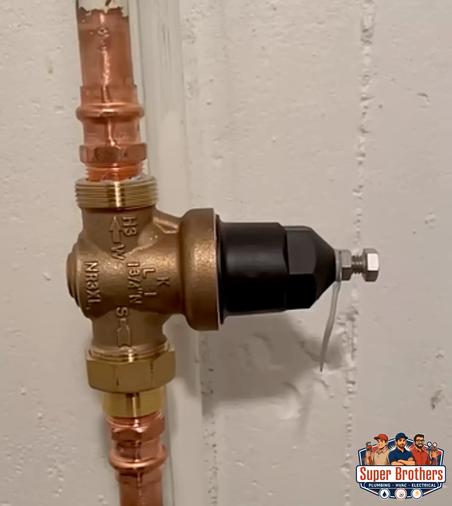 Older Bay Area home plumbing setup with main shutoff and pressure reducing valve