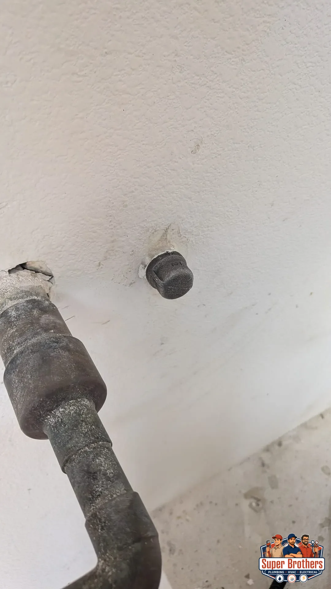 water heater gas line connection capped off in prep for heat pump installation