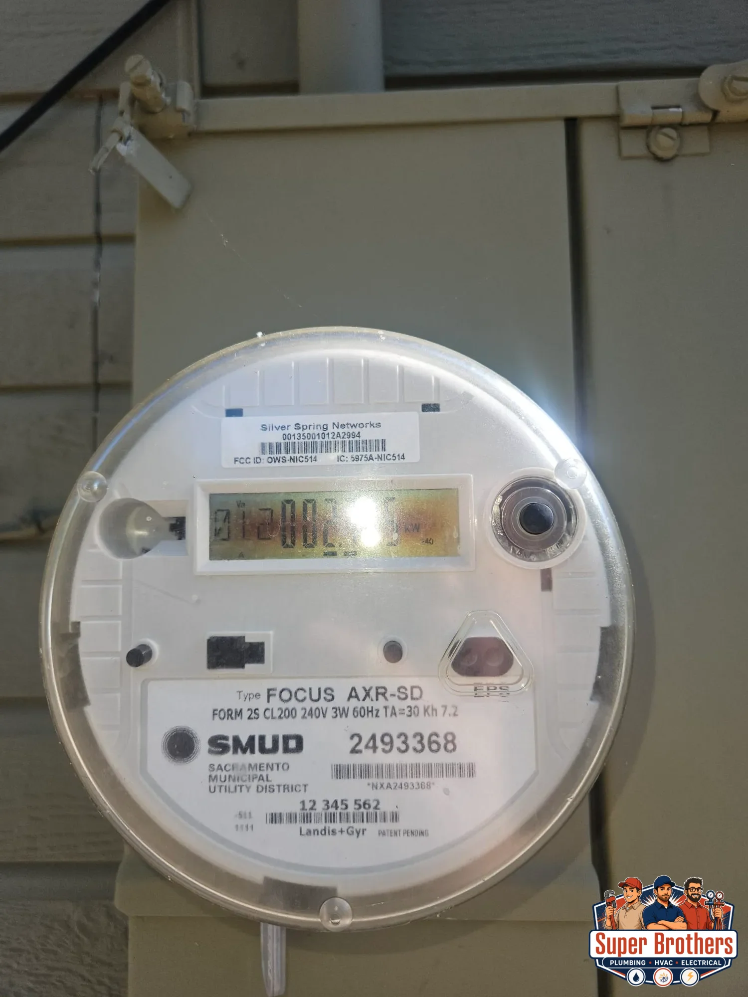 SMUD electric meter documented during rooftop AC service visit