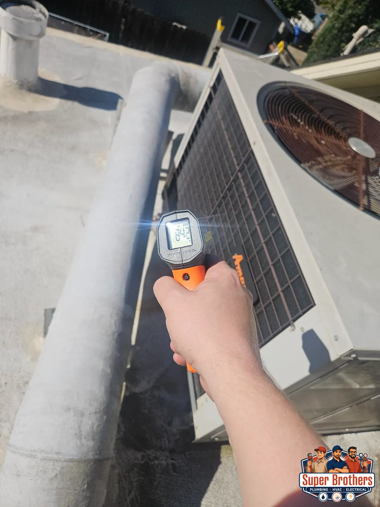 technician testing rooftop hvac unit in sacramento